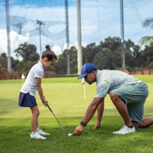 girl playing golf